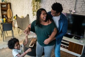 Family dancing and laughing together