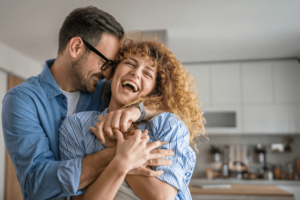 Happy adult caucasian couple at home husband and wife family concept.