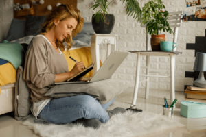 Copy space shot of businesswoman writing notes while working.